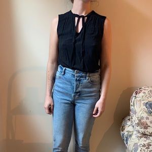Black sleeveless blouse with tie neck